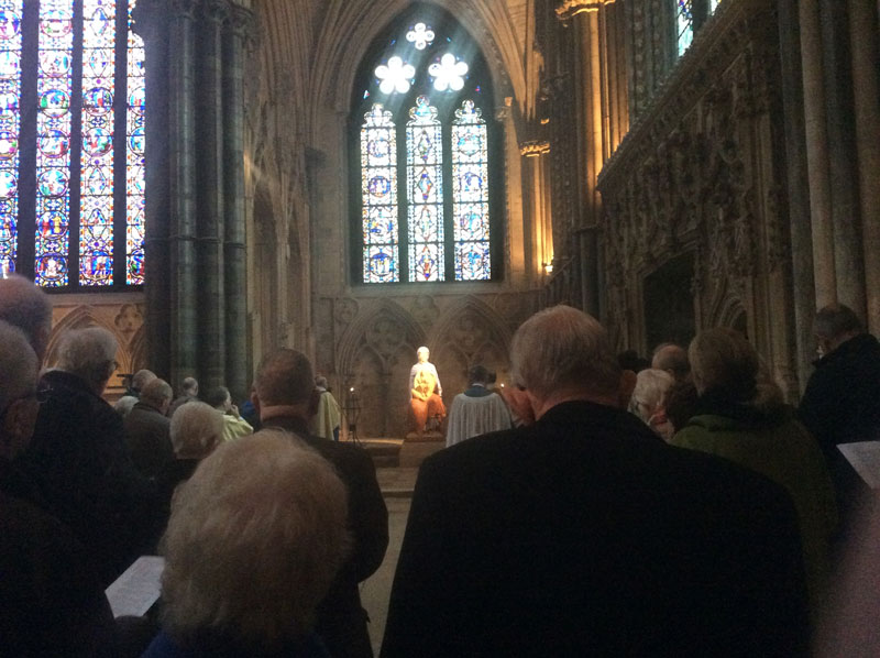 Prayers at the statue of Our Lady